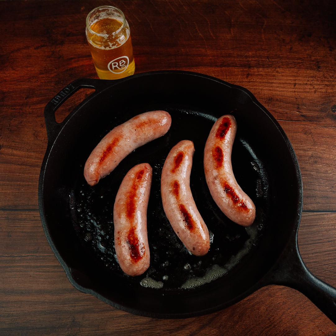 Bovine & Swine sausages grilled in cast iron pan